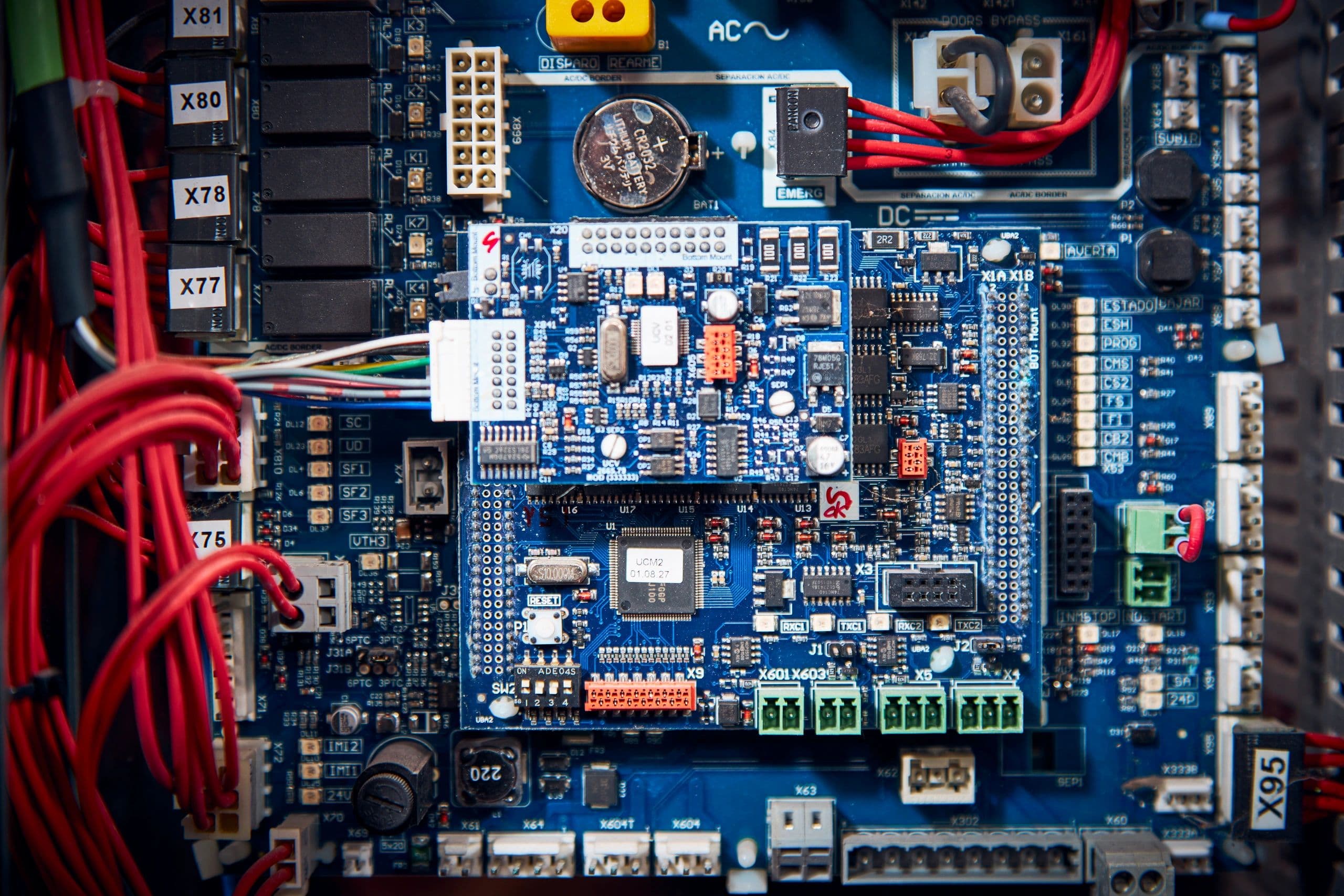 Close-up of a complex blue elevator printed circuit board